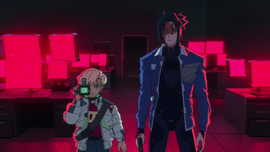 "Two animated characters, one holding a camera, stand in a dark room filled with computers displaying bright red screens, creating a dramatic, cyberpunk atmosphere."